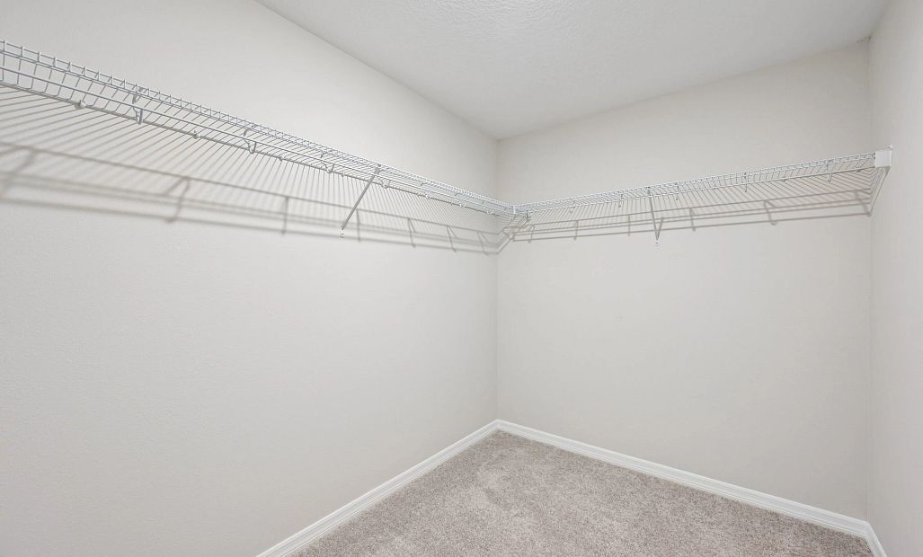 A large walk-in closet is located off the primary bathroom