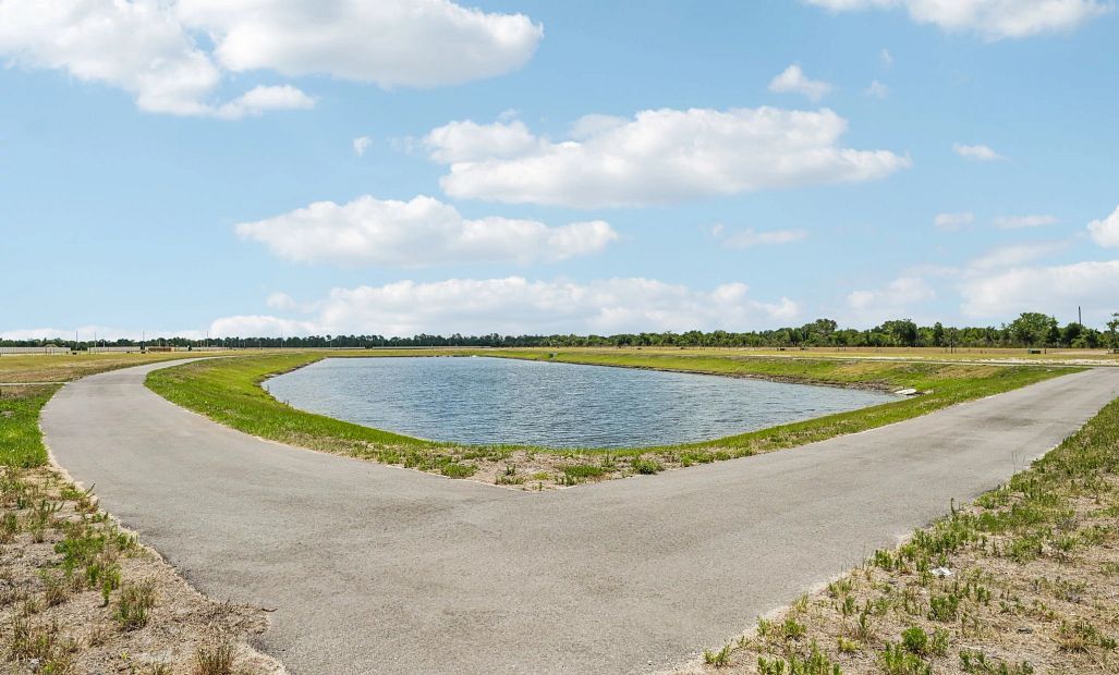 This home is located at the corner of the pond with stunning views and easy access to the walking