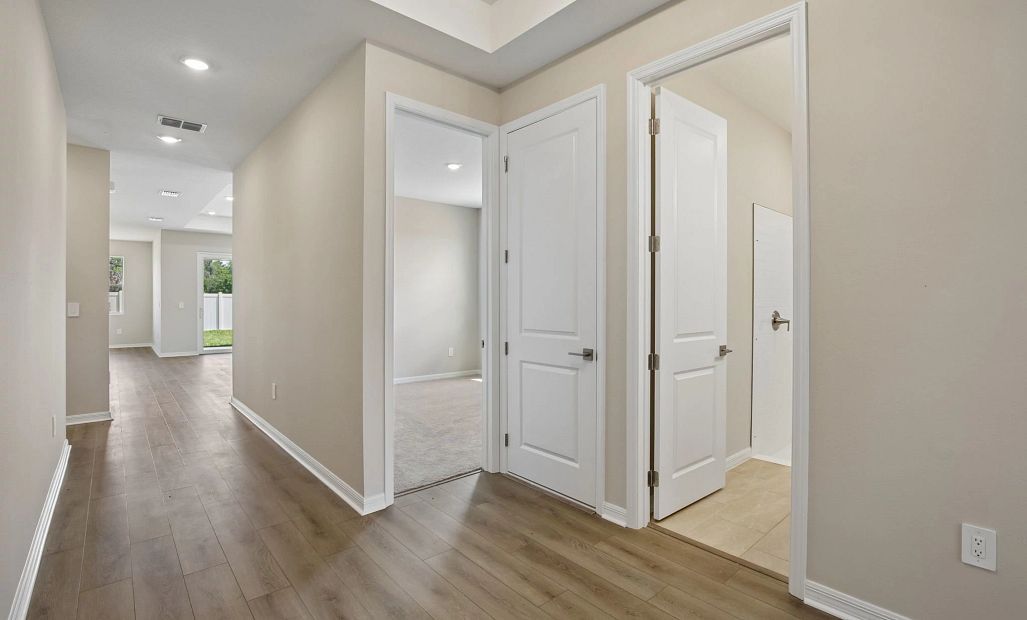 As you enter into the home you are welcomed by the secondary bedrooms