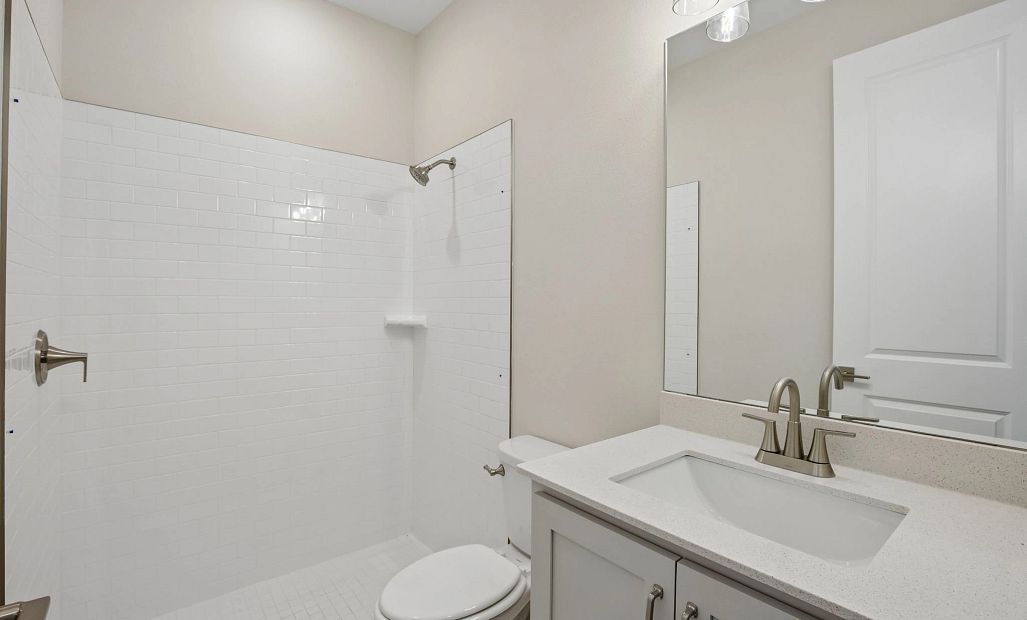 Bathroom 2 is located right off the front foyer hallway