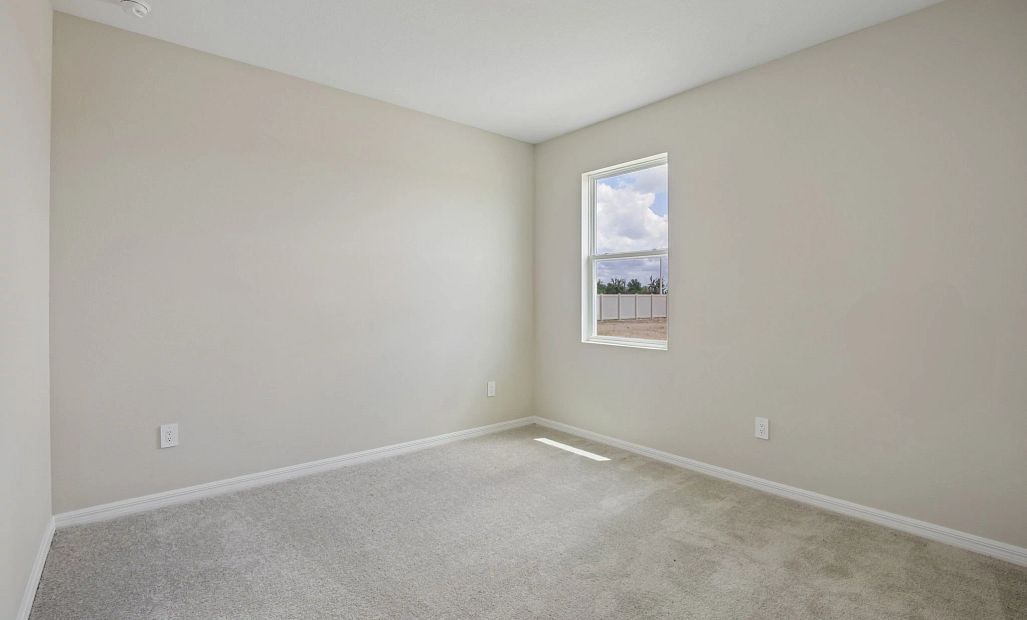 Bedroom 2 is located near bedroom 3 off the side of the home