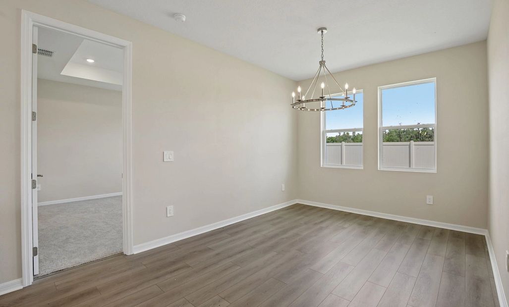 Off the kitchen is the dining room with double windows for natural lighting