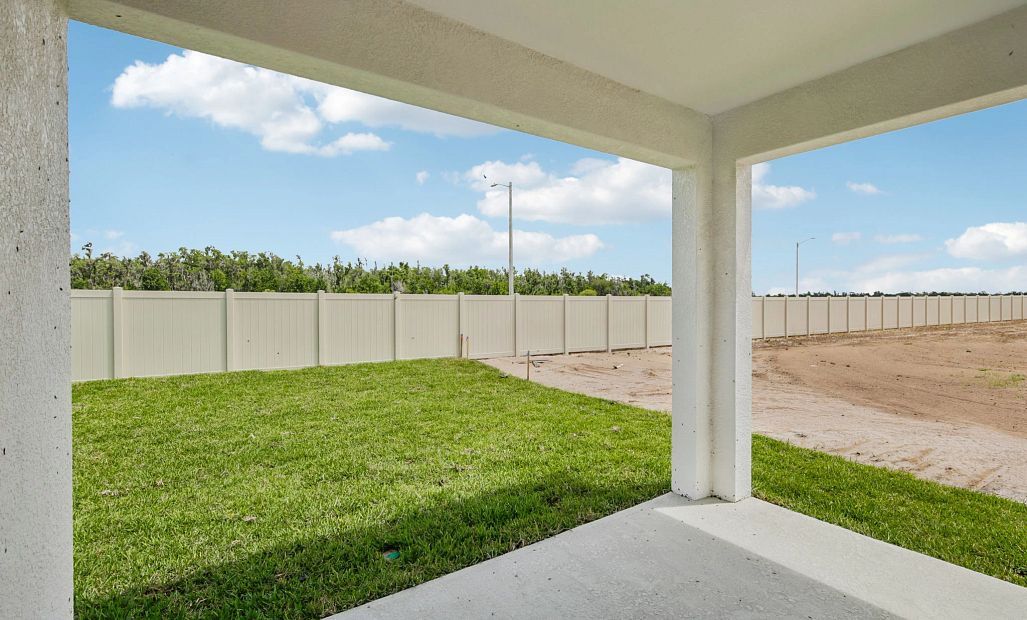 This beatuiful covered back lanai makes the perfect space for dining outdoors