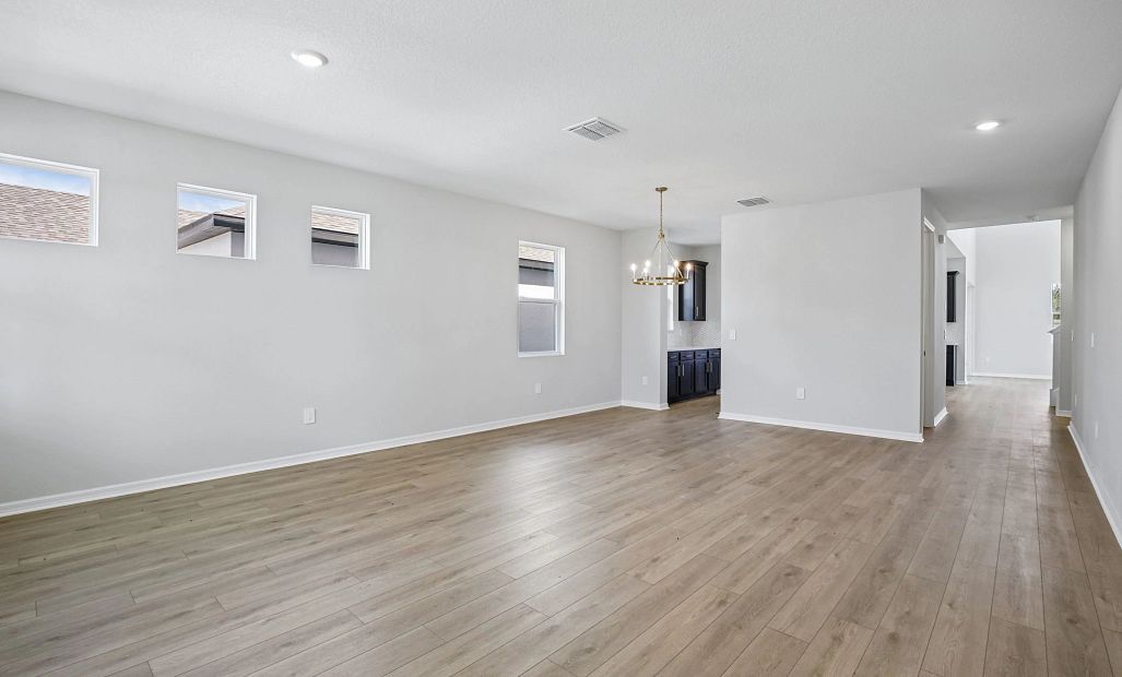 Upon entry into the home you are welcomed into a flex space that leads you into the dining room