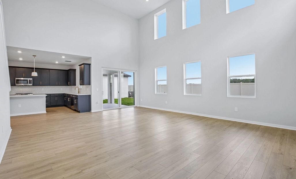 The great room and this kitchen are going to wow anyone who walks in the door