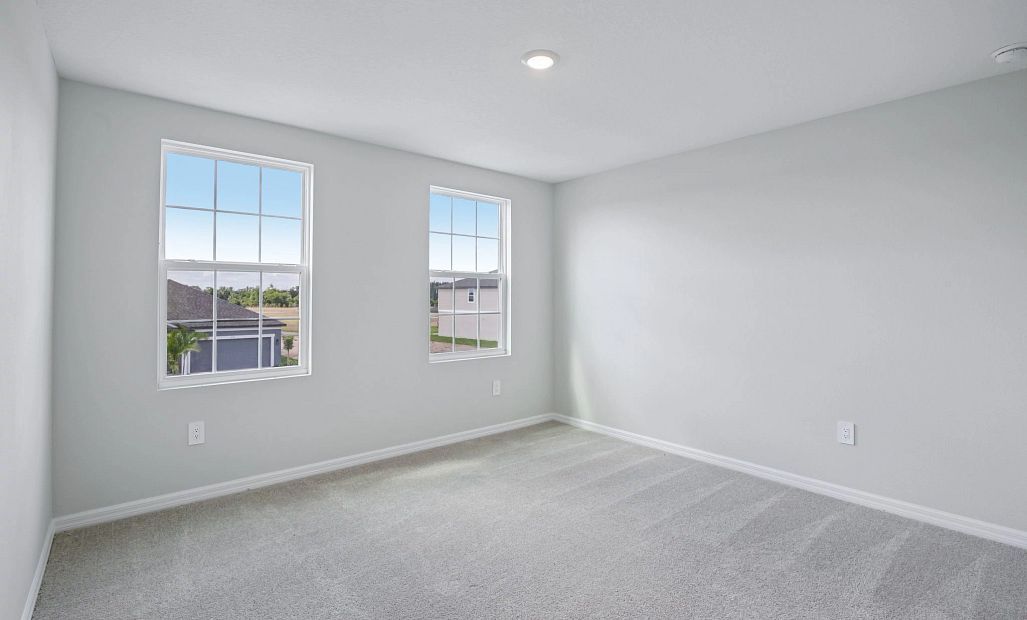 Moving down the hall we enter bedroom 2 also located at the front of the home with double windows