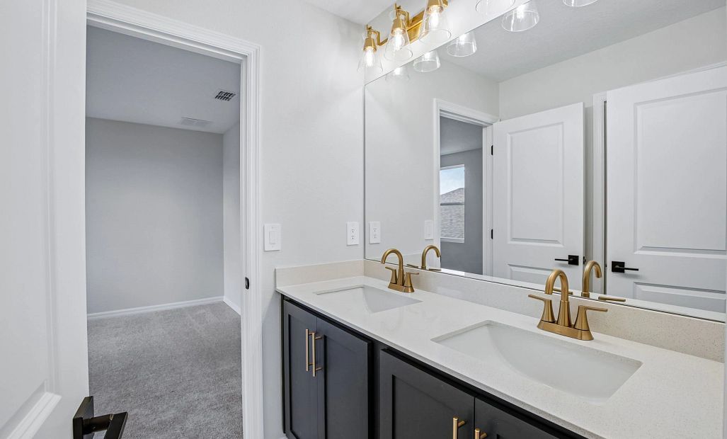 Bathroom 2 connects bedroom 2 and 3, features double sinks and features aspects of AW Collection®