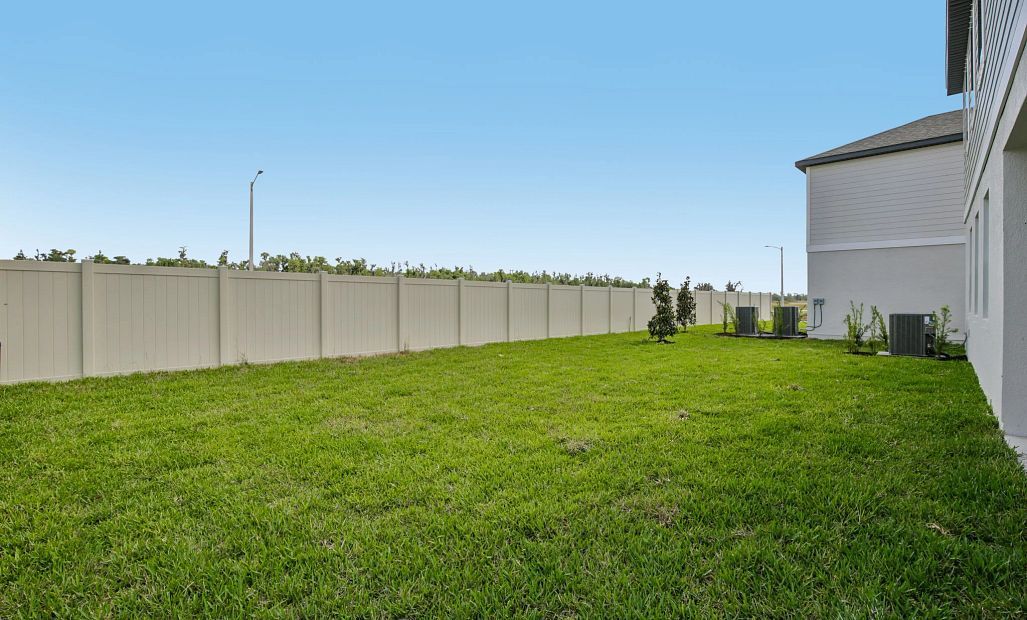 Spacious backyard off this home with a privacy fence