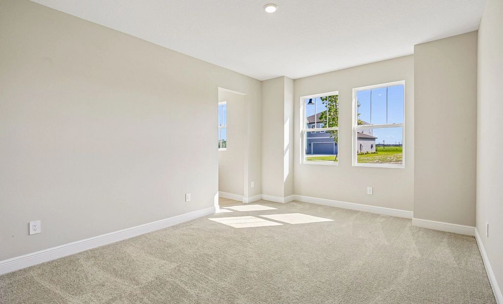 Off the foyer is bedroom 3 located at the front of the home with double windows