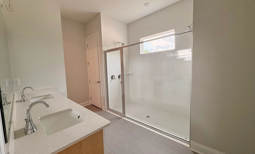 Primary bathroom with double sinks and an oversized walk-in shower - under construction