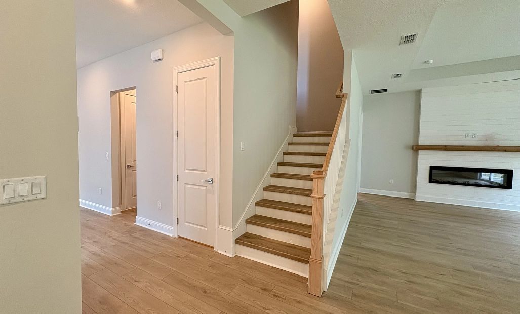 Staircase to secondary bedrooms featuring a beautiful wood spindle railing