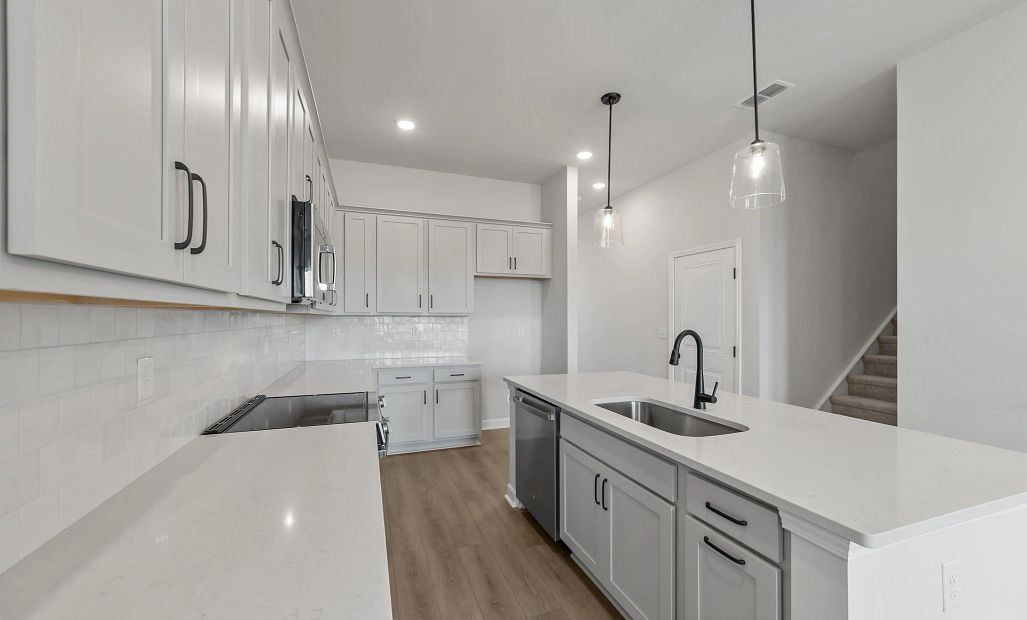 Sample Kitchen photo. Actual structural options and design finishes of home may vary.