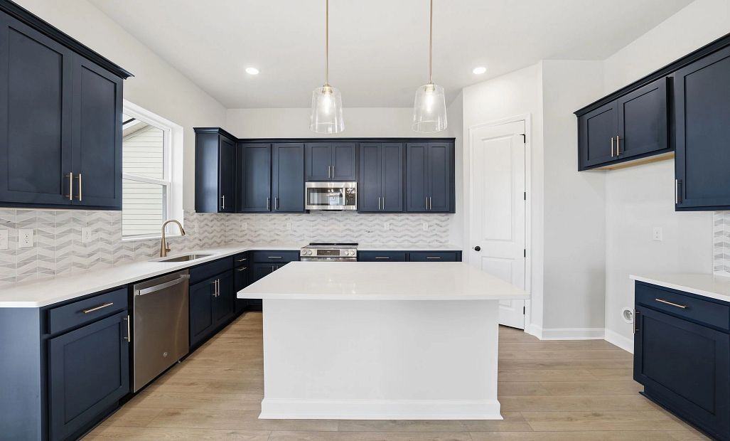 Sample Kitchen photo. Actual structural options and design finishes of home may vary.