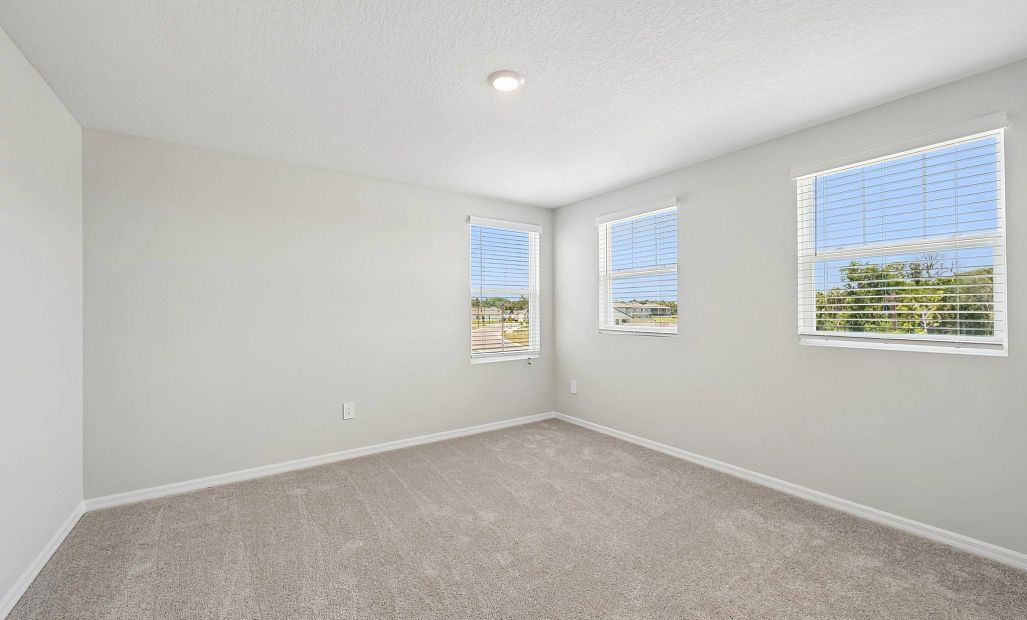 Bedroom 3 features three windows for great natural light