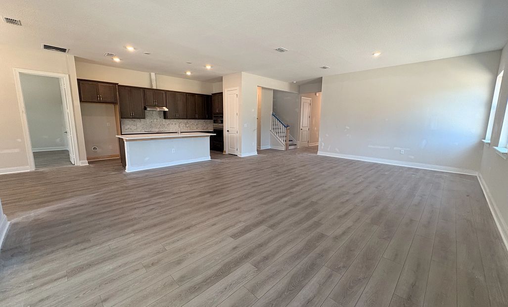 Open concept layout make the kitchen and family room feel well connected - under construction