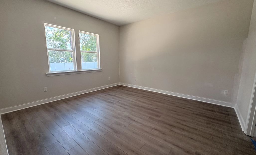 Spacious primary bedroom located off the back of the home - under construction