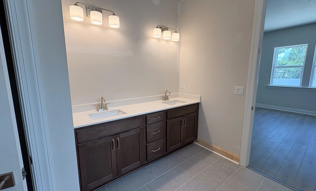 Primary bathroom featuring aspects of AW Collection® Roosevelt and double vanity - under