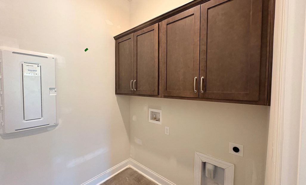 Laundry room features AW Collection® Roosevelt upper cabinets - under construction