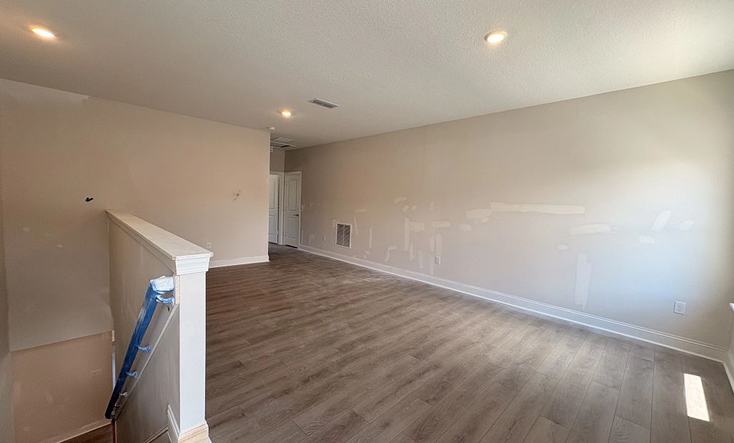 Upstairs you will find a spacious bonus room - under construction