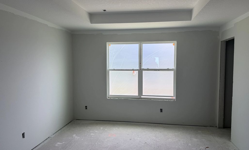 Primary bedroom with a tray ceiling - under construction