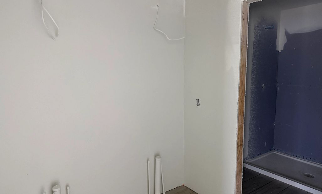 Primary bathroom will feature double sinks and a frameless walk-in shower - under construction