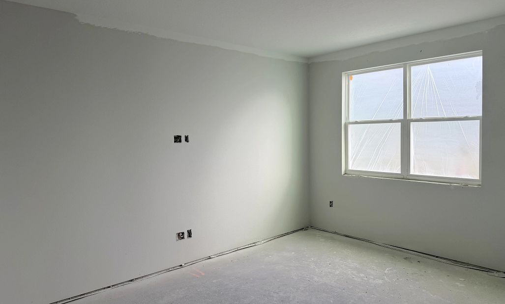 Family room space with two large windows - under construction