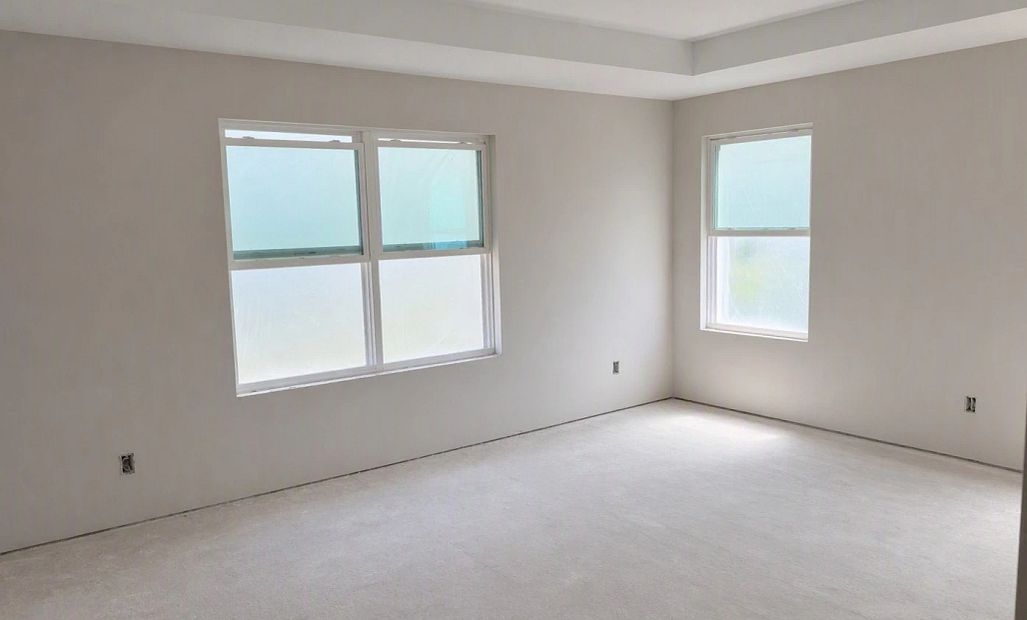 Primary bedroom featuring a tray ceiling - under construction