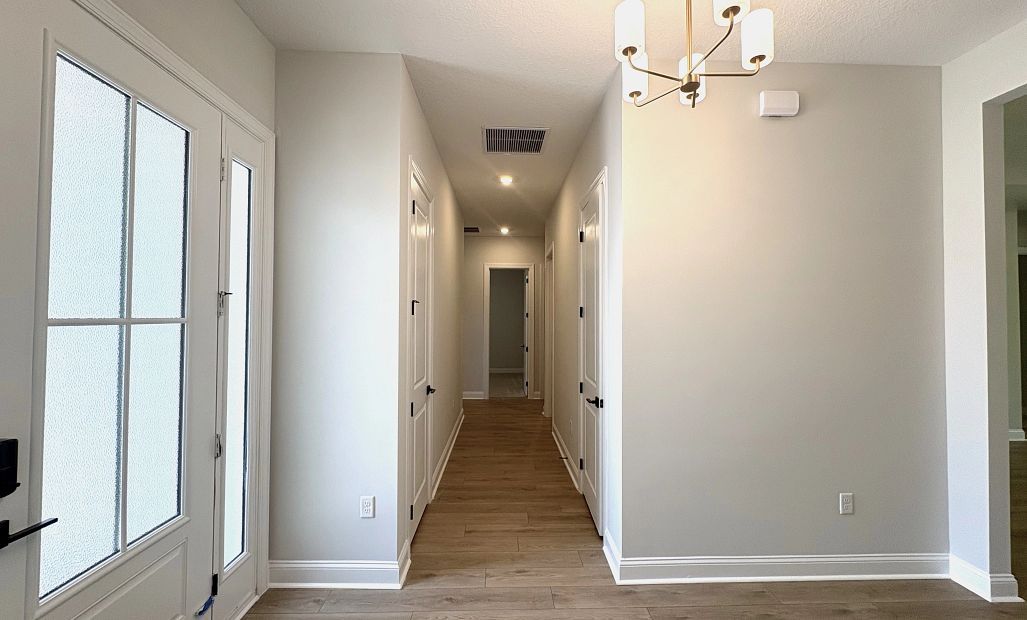 Hallway to secondary bedrooms off the foyer