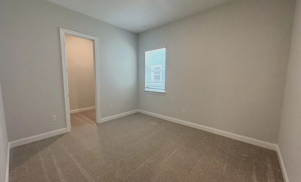 Spacious bedroom 2 with a walk-in closet
