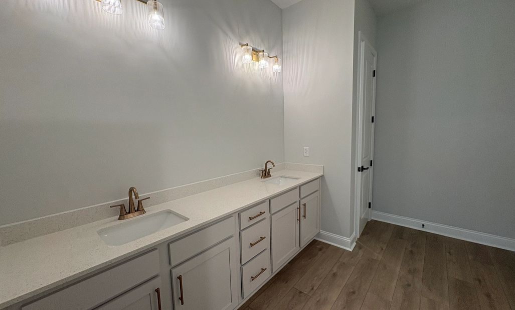 Hi Mary, bathroom featuring double sinks and aspects of AW collection Serene