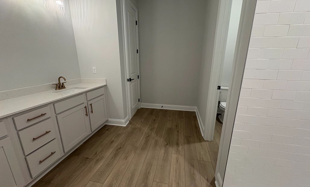 Primary bathroom also features a linen closet