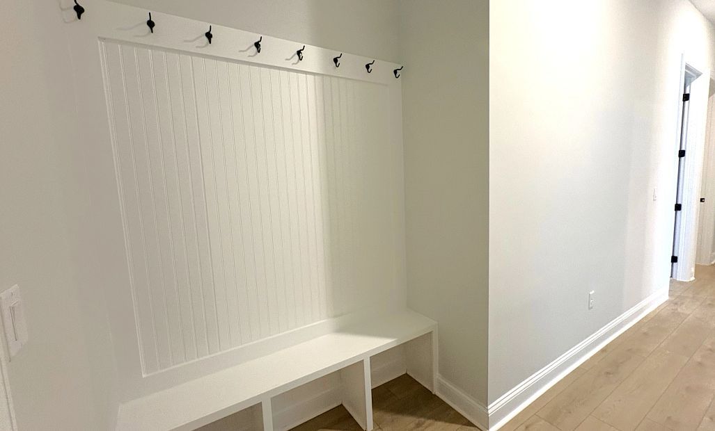 Built-in valet located just off the garage