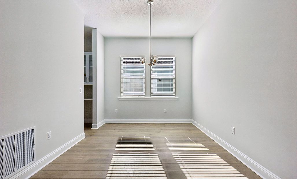 As you continue down the foyer you will find the dining room