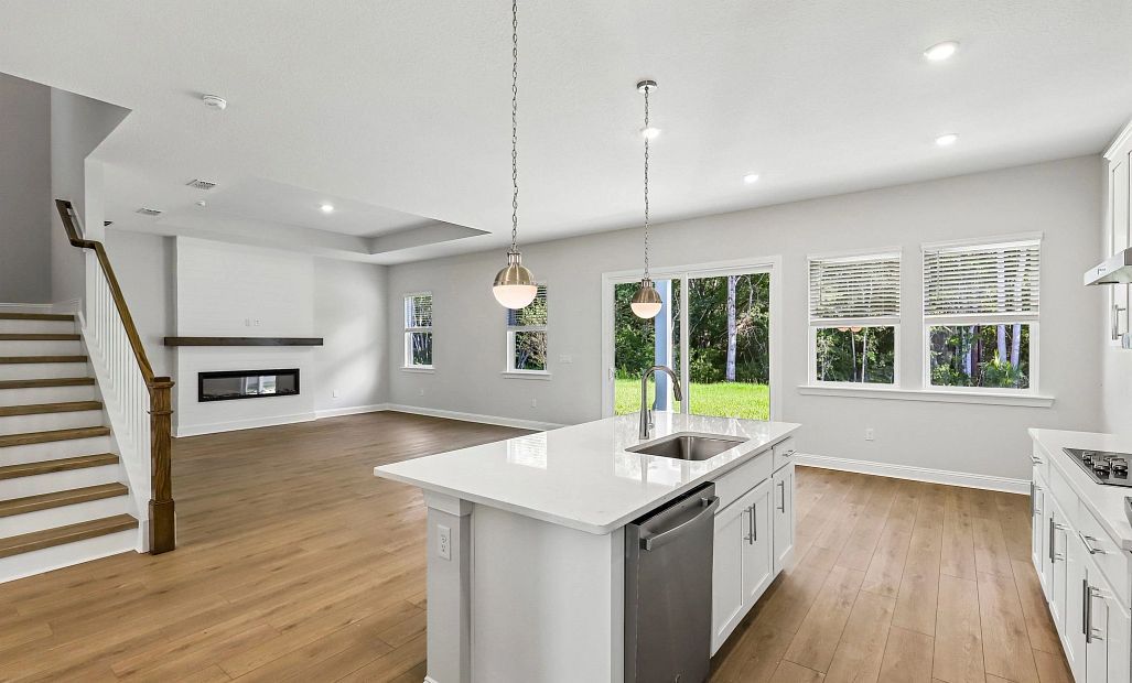 As you continue through the butler's pantry you walk into the open concept kitchen and living space
