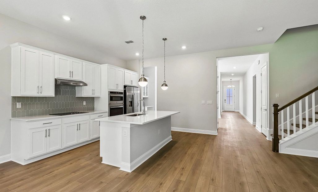 The kitchen space features a generous sized island that really connects the space with the family