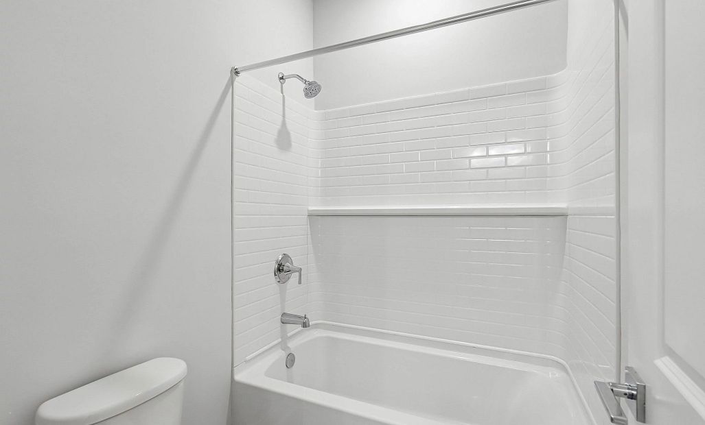 The jack and jill bathroom also has a separate space for the toilet and shower