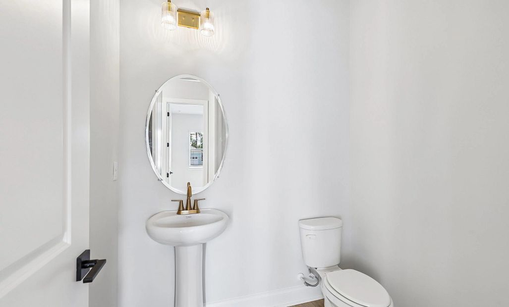 Half bathroom located just of the main foyer making it centrally located for guests