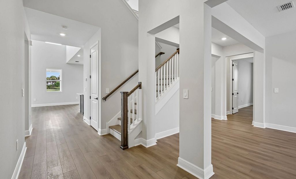 Foyer into the home welcomes you into the dining space to the right