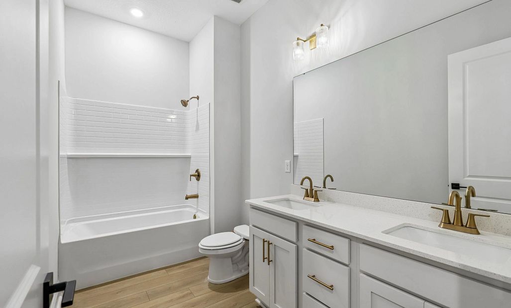 Bathroom 2 features a double sink vanity