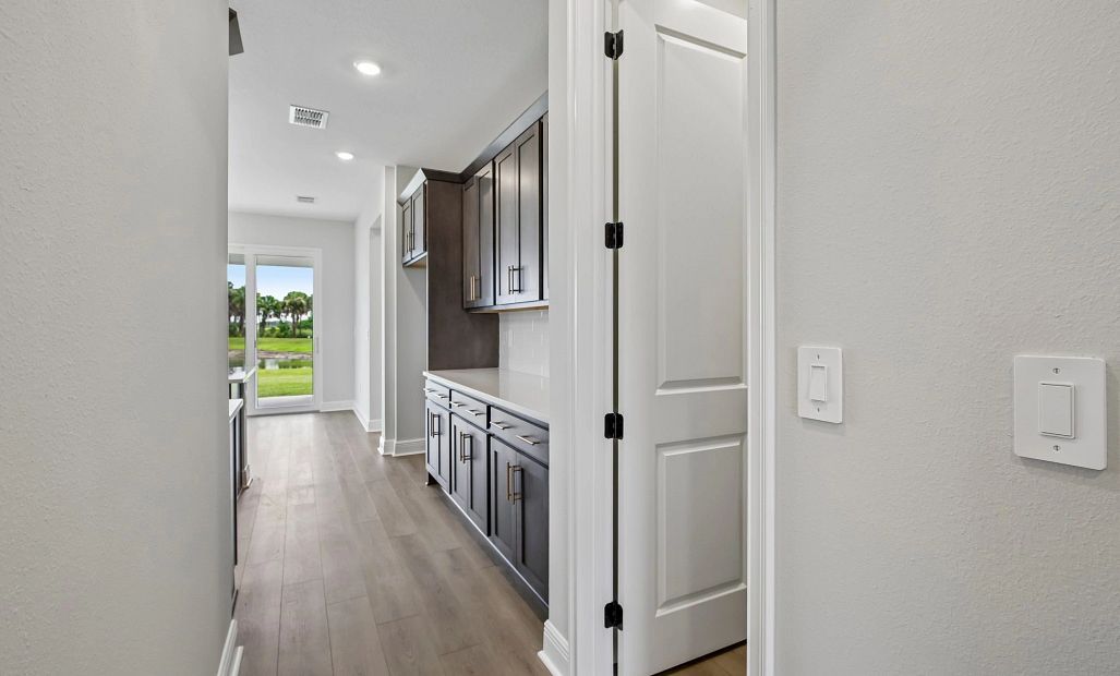 As you continue down the hall you walk into the kitchen space