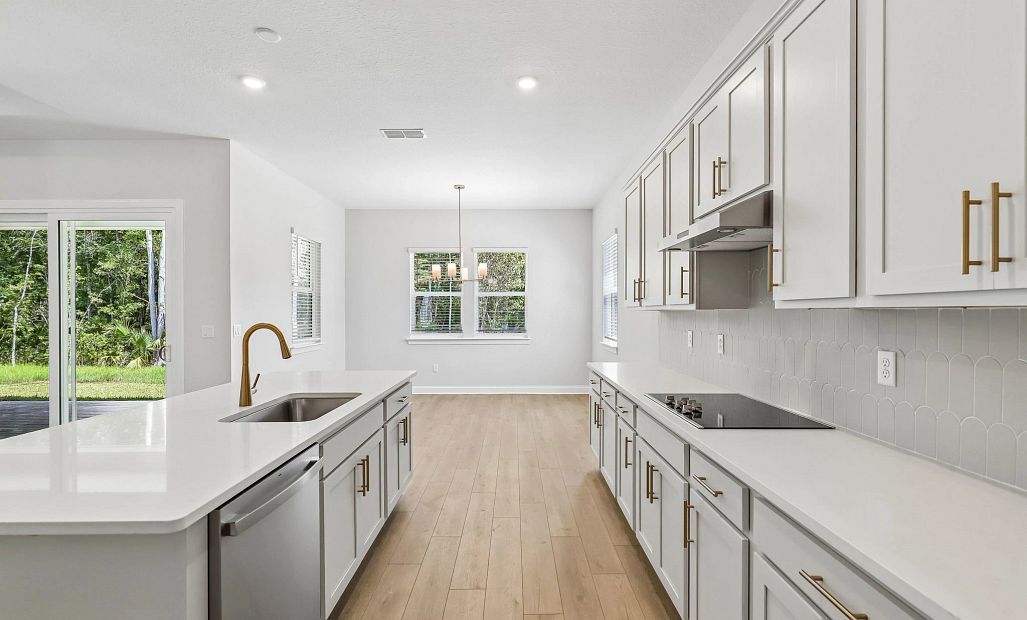 The kitchen leads you into the separate dining space