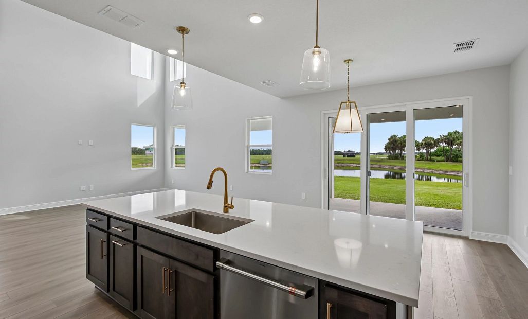 The kitchen also has a stunning view of the pond in the backyard