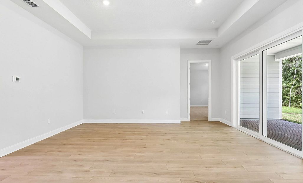 The family room space is perfectly connected to the kitchen and covered lanai making it the ideal