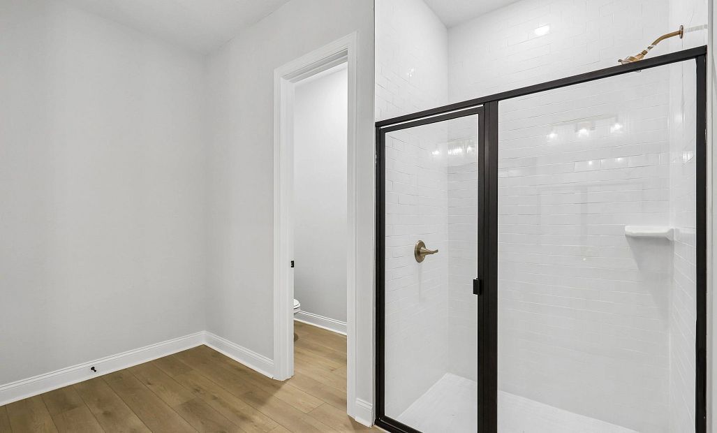 The primary bathroom also has a walk-in shower