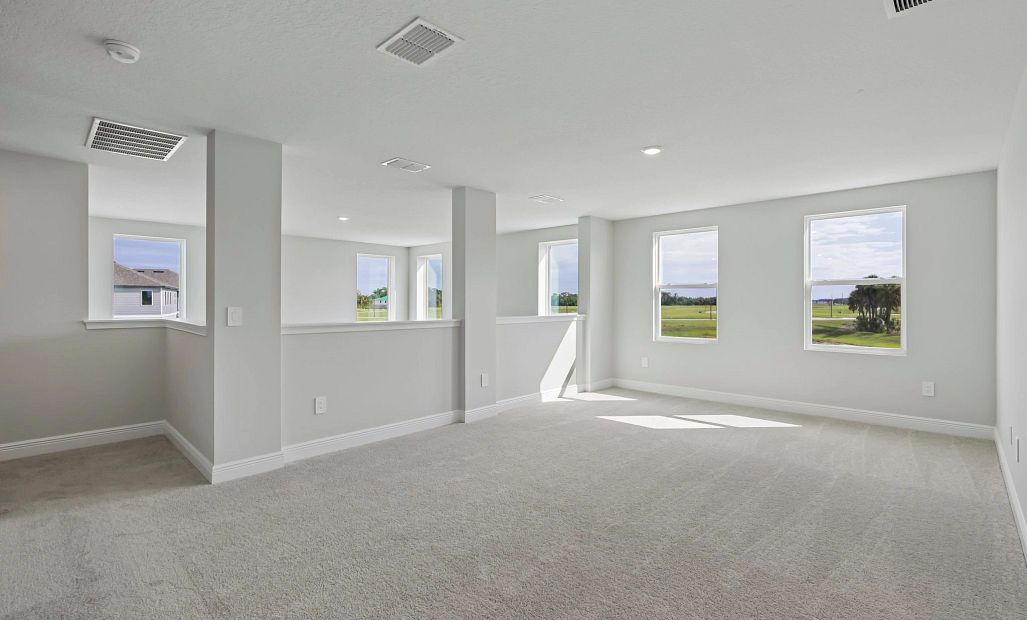 As you reach upstairs you are welcomed into the large open bonus room that looks out on to the