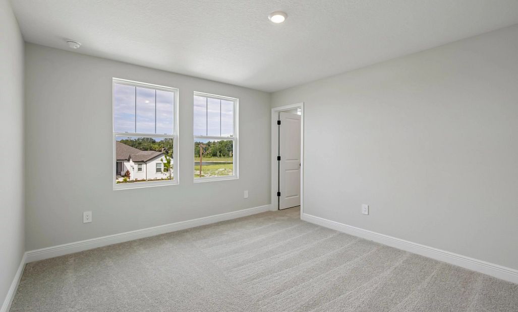 Bedroom 2 is located off the front of the home and features a walk-in shower
