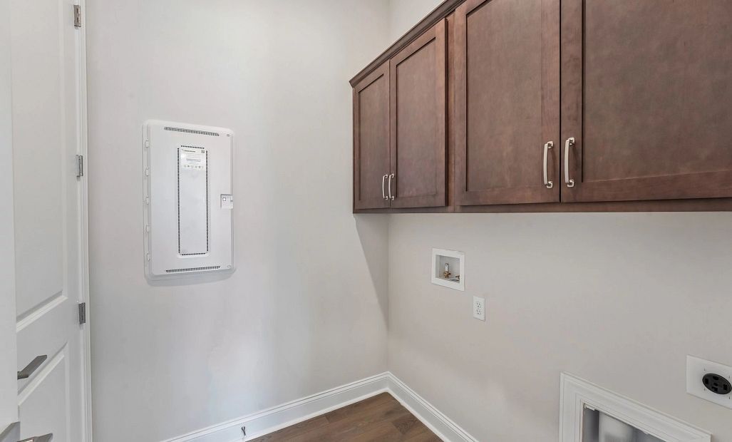 Laundry room featuring upper cabinets