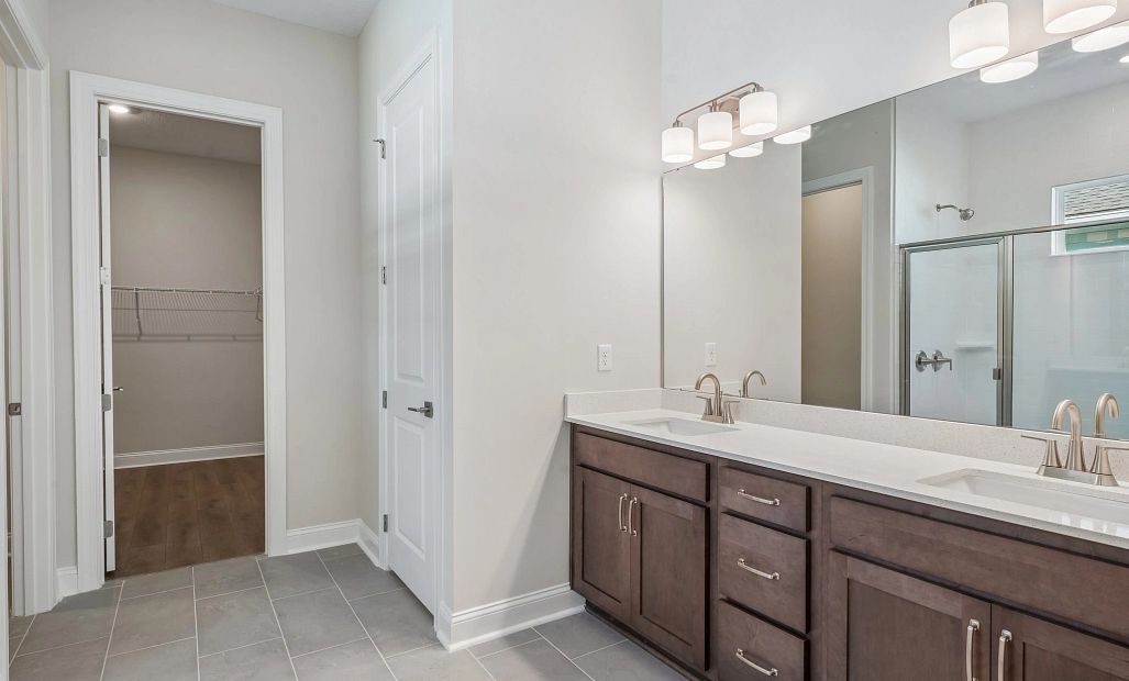 Primary bathroom with double sinks featuring AW Collection® Roosevelt