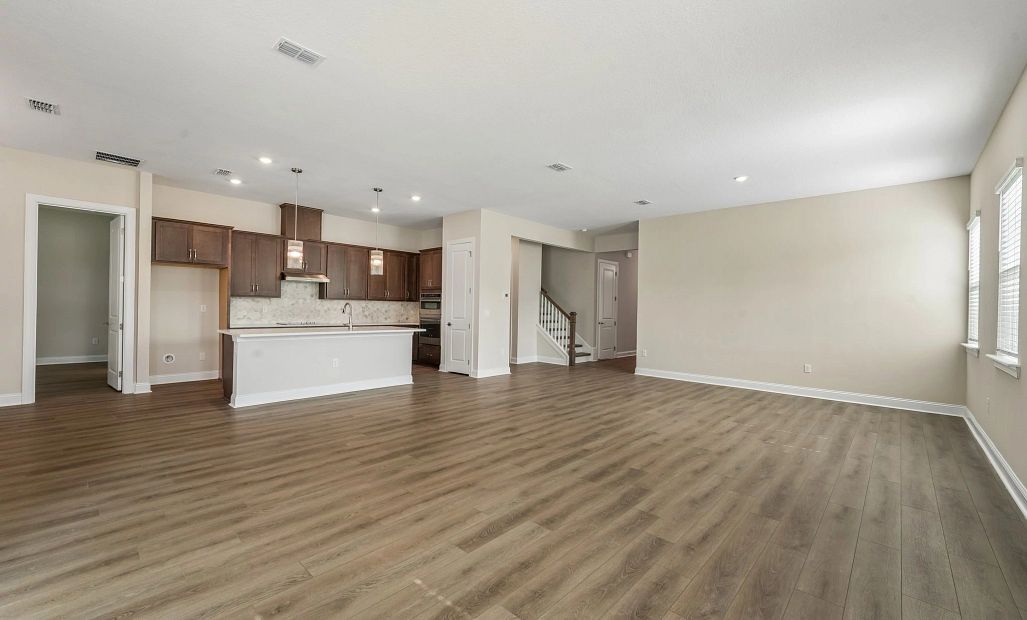 Open concept living, kitchen and dining rooms