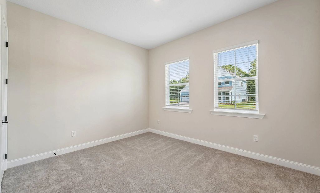 Spacious bedroom 4 located off the front of the home
